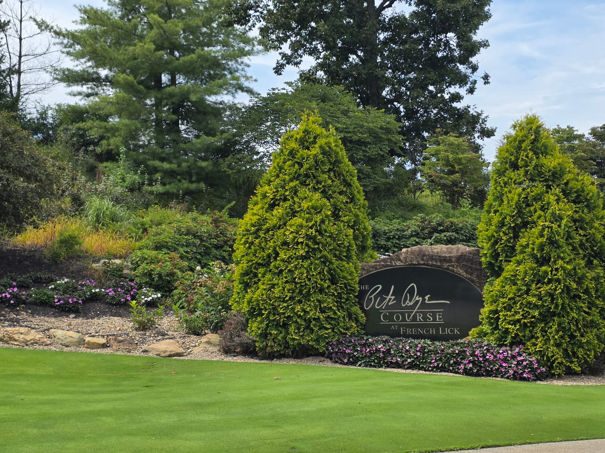 The Pete Dye Course entrance — a signature in stone and gardens