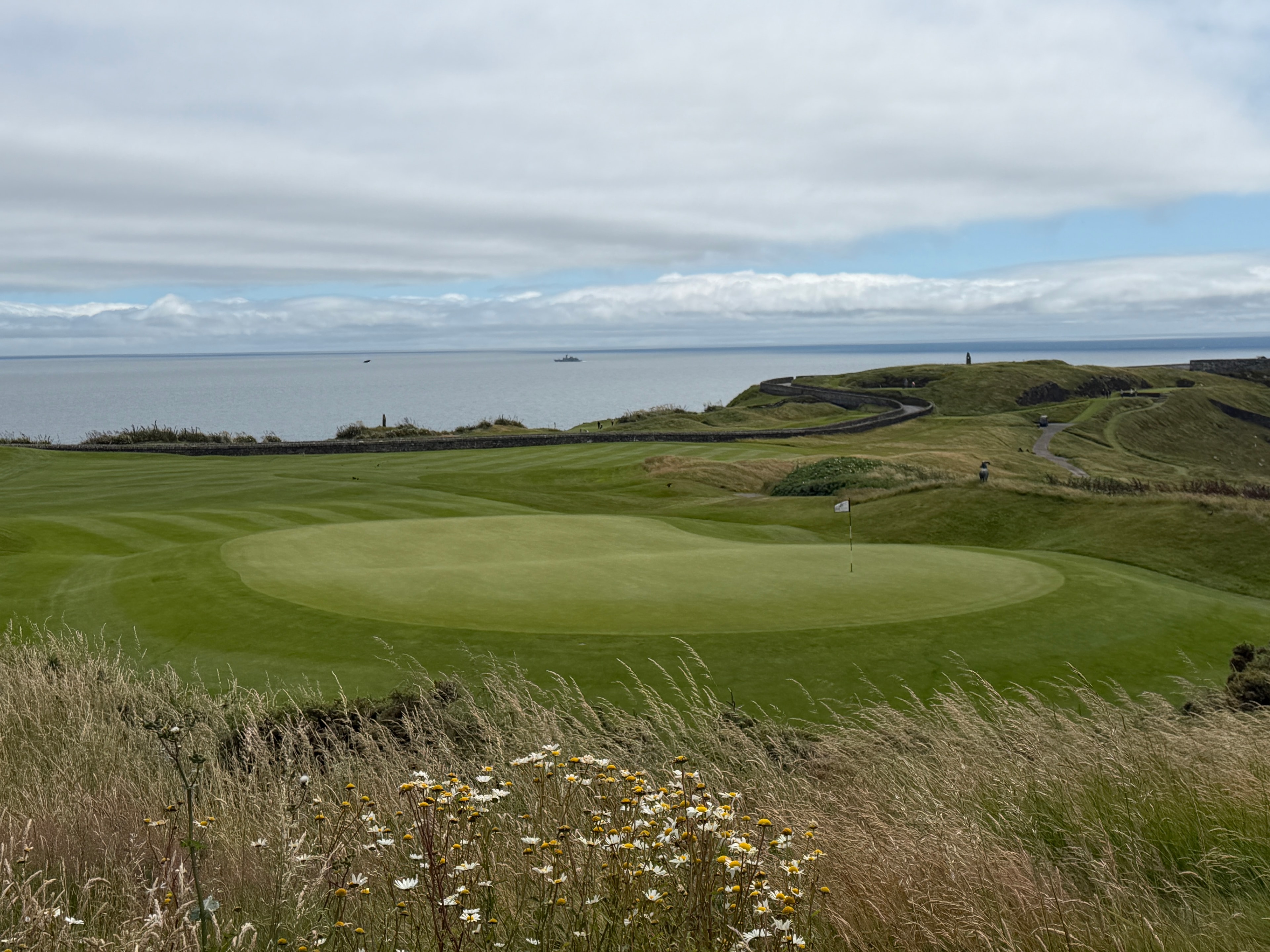 Clifftop green with the Atlantic beyond
